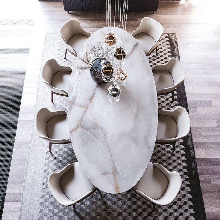 Roll Keramik table de Cattelan Italia, signée Paolo Cattelan, allie innovation, élégance et équilibre grâce à sa base cylindrique sculpturale et son plateau en céramique Marmi raffiné. Disponible chez D-Style Interior.