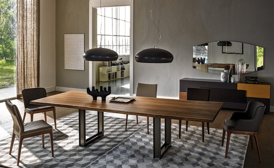 Sigma table de Cattelan Italia allie bois massif et métal pour un design sculptural, contemporain et raffiné. Une pièce d’exception signée du savoir-faire italien. Disponible chez D-Style Interior.